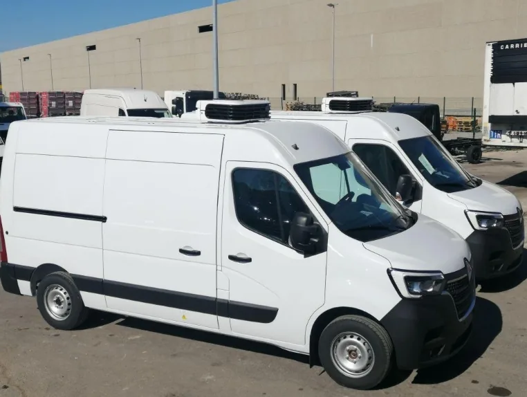 White cargo vans with roof-mounted Carrier refrigeration units